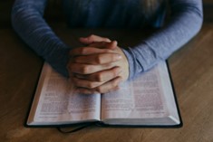 Women in prayer or wearing crosses